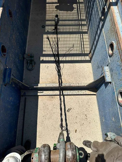 Steel wire rope specimen after a break test inside the test bed working area