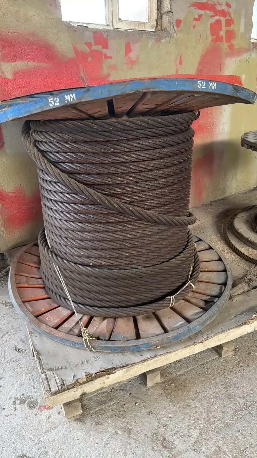 Steel wire ropes and coils in an industrial area